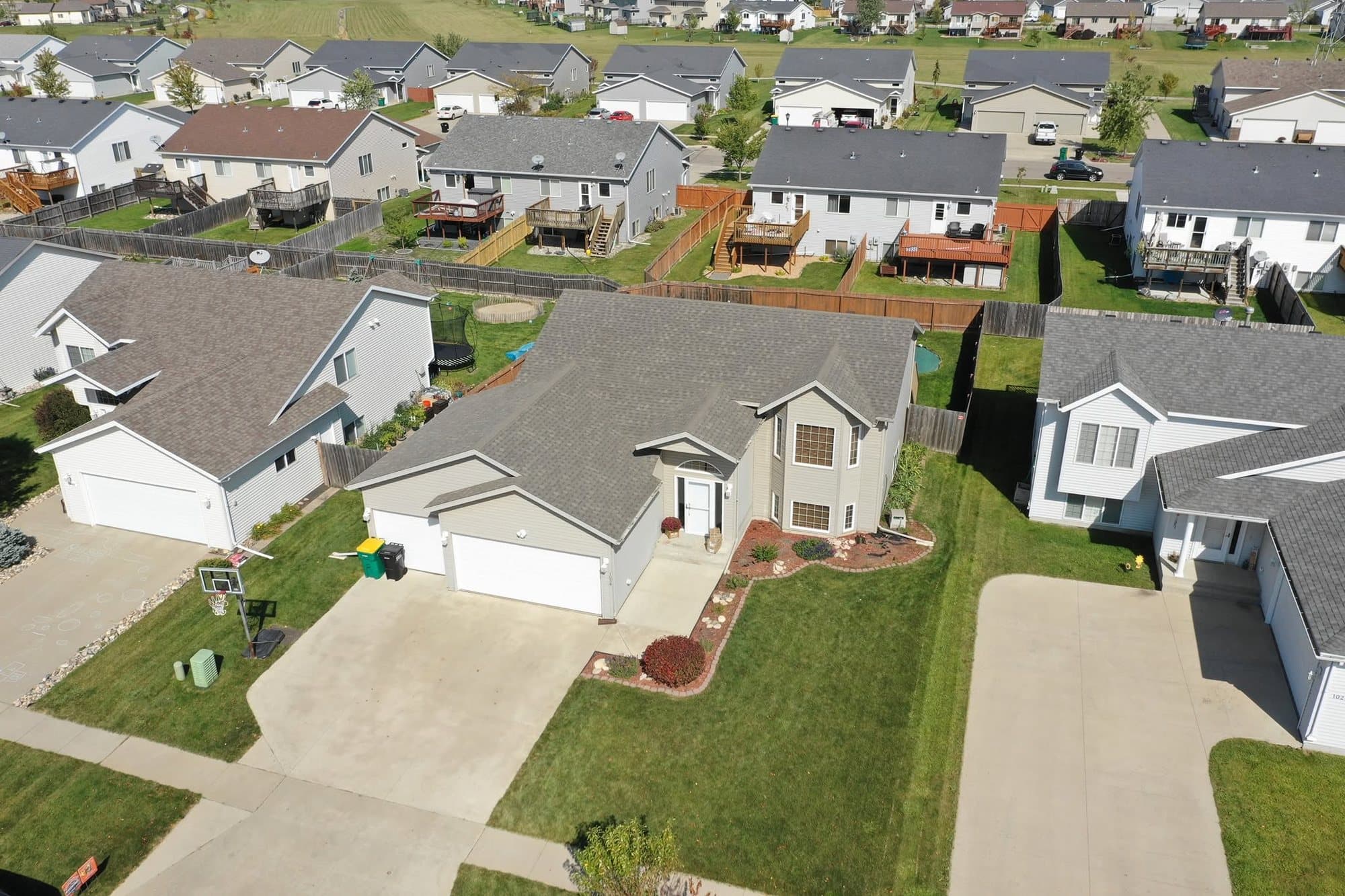 Split-level home with a new gray roof in a Fargo–Moorhead neighborhood